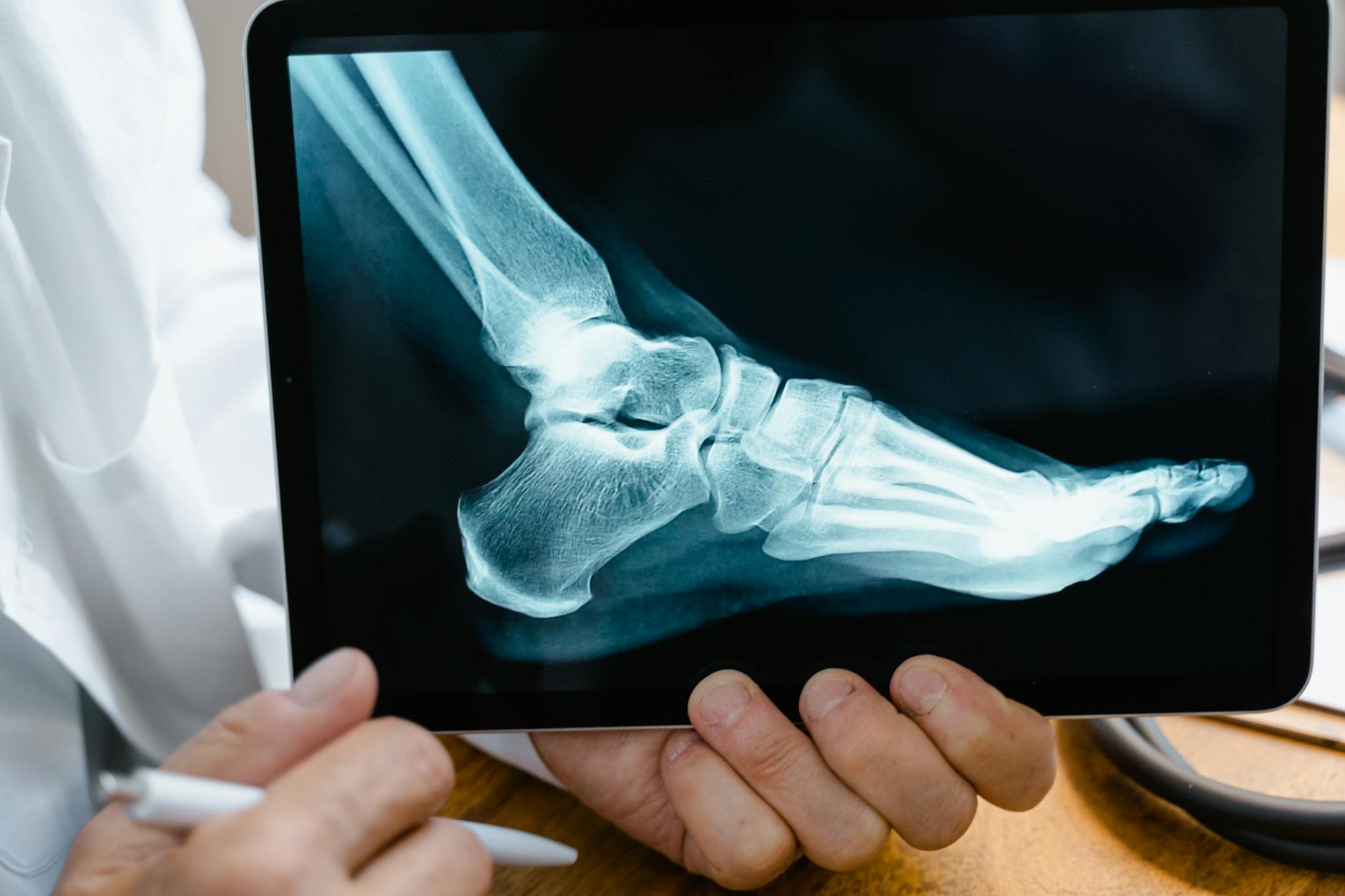 person holding black tablet computer